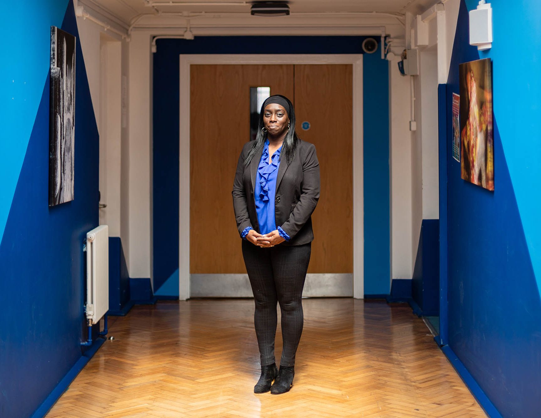 portrait of a woman in a school corridor